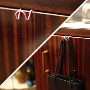 Pink Color paper clip used as bag holder with drawer