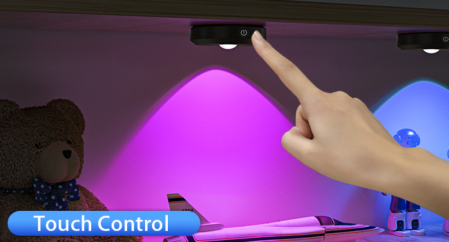 Touch-controlled color-changing light fixture. Hand pointing to control, with purple and blue illumination visible. Teddy bear in background.