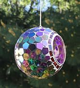 iridescent purple mosaic hanging bird feeder for small birds in a backyard on a shepherd hook