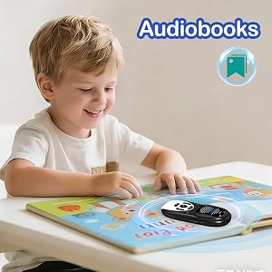 Text reads 'Audiobooks'. Child sitting at table with picture book and black audio device, focusing on interactive learning experience.