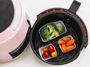 Square and rectangle silicone baking cups in an air fryer with vegetables