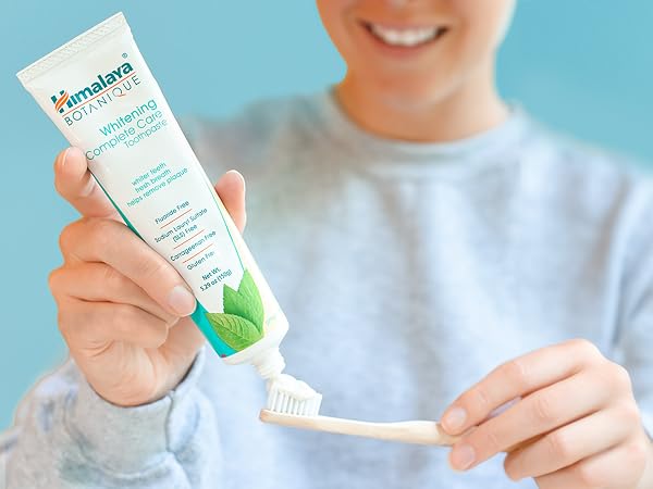 woman and toothpaste