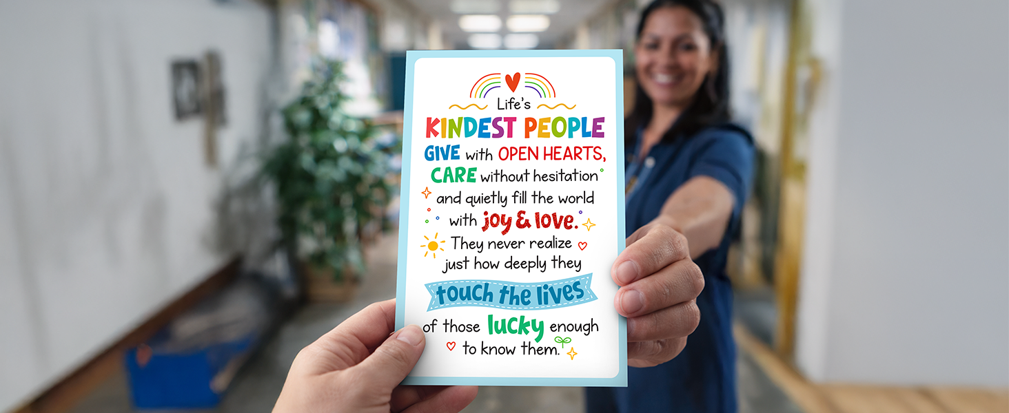 A photo of a hand giving social worker appreciation cards to a nurse.