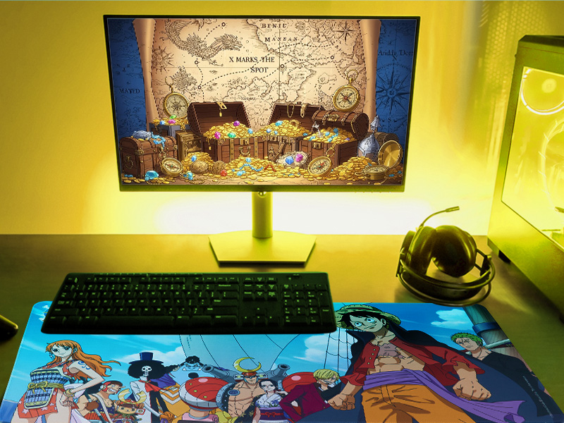 Computer setup in dim lighting showing a monitor, keyboard, and mouse on a desk with ambient yellow lighting.