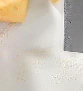 bread dough cutter tool portioning soft dough on floured baking board