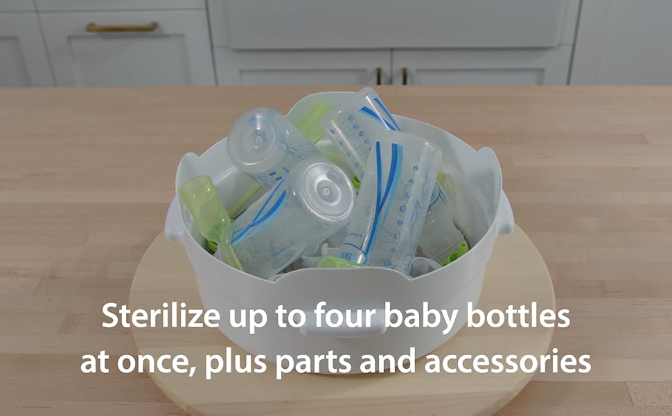 baby bottles in microwave sterilizer on counter top