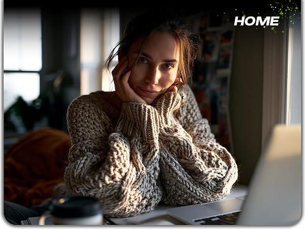 Woman stretching comfortably at home office desk after using ergonomic mouse pad wrist rest