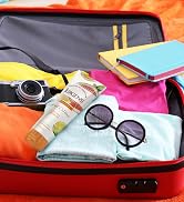Jergens Citrus Body Butter in a suit case on top of clothes