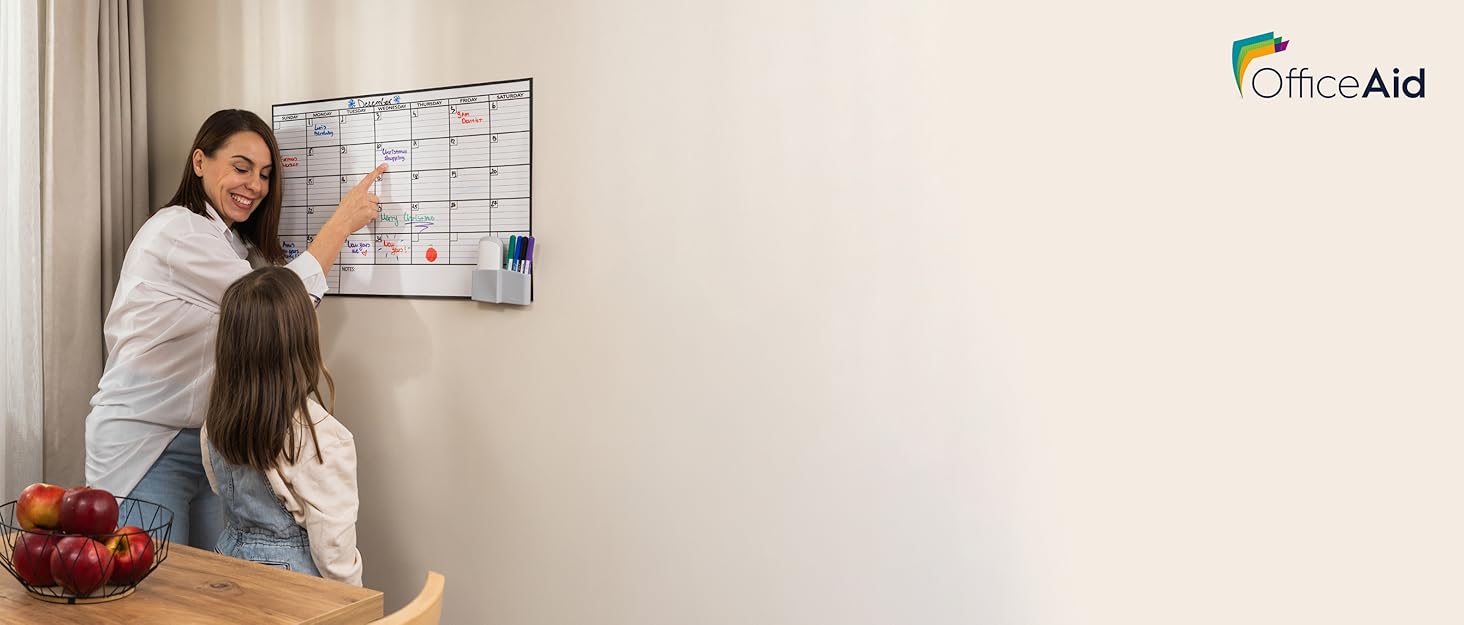 OfficeAid dry erase wall calendar used by a parent and child at home