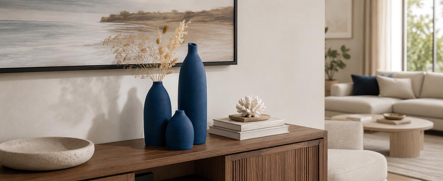 Matte coastal blue ceramic vase set displayed on a modern fireplace mantel with neutral home decor.