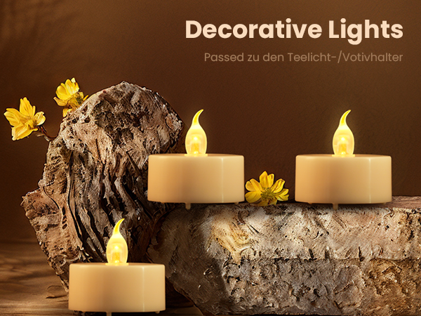 Three LED flameless candles with warm flickering light, displayed on natural wood or bark, surrounded by yellow flowers.