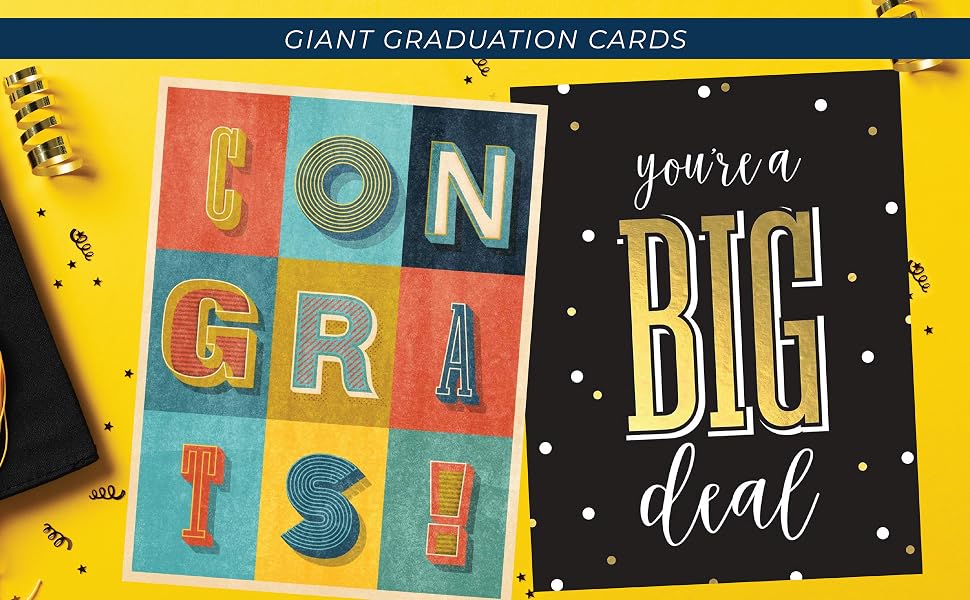 Two jumbo congratulations graduate folded greeting cards near a grad cap and tassle.