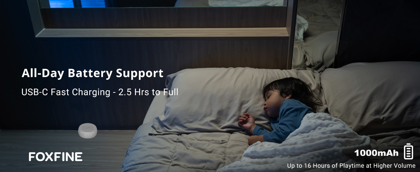 Sleeping child with sound machine on bedside table, indicating long battery life for overnight use
