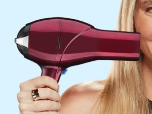 Woman holding hair dryer