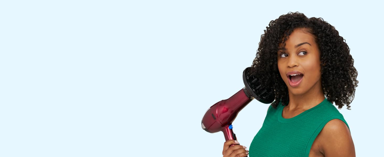 Woman using hair dryer with diffuser