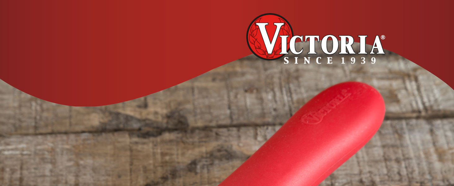 A silicone handle cover for Victoria cast-iron skillets. Text reads: Victoria since 1939.