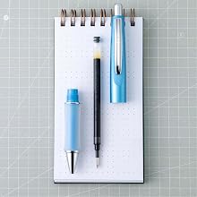 Photo shows de-constructed Dr. Grip Limited pen on a desktop
