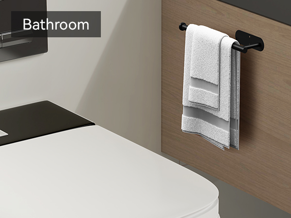 Black wall mounted towel holder on bathroom vanity cabinet for hand towels