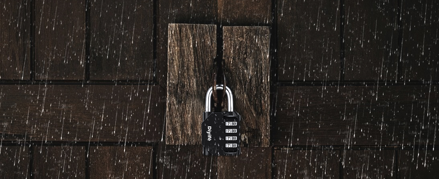 Combination lock hanging on dark wooden surface, possibly a door or fence. Rain or water droplets visible.