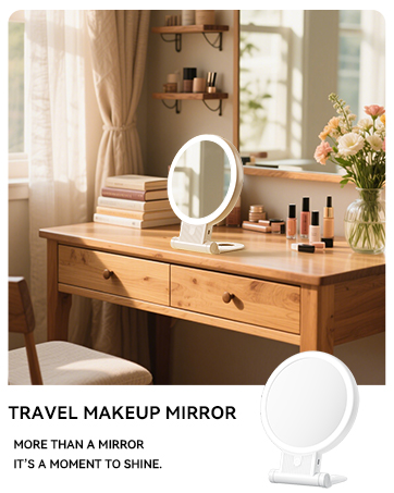 Circular lighted makeup mirror on a wooden vanity table. Mirror has a foldable stand and is surrounded by cosmetics, books, and a flower vase in a cozy bedroom setting.