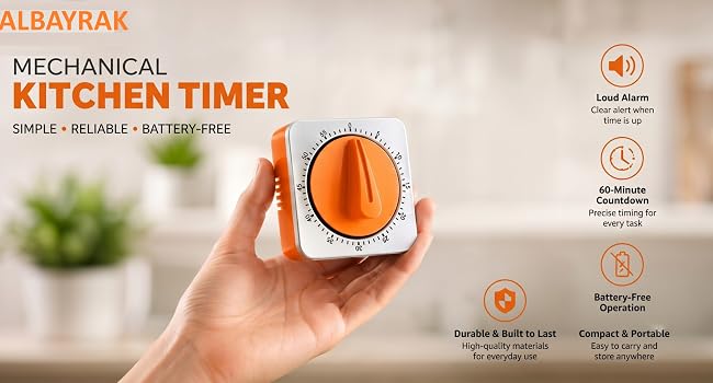 ALBAYRAK mechanical kitchen timer held in a hand, showcasing its compact orange and silver design.