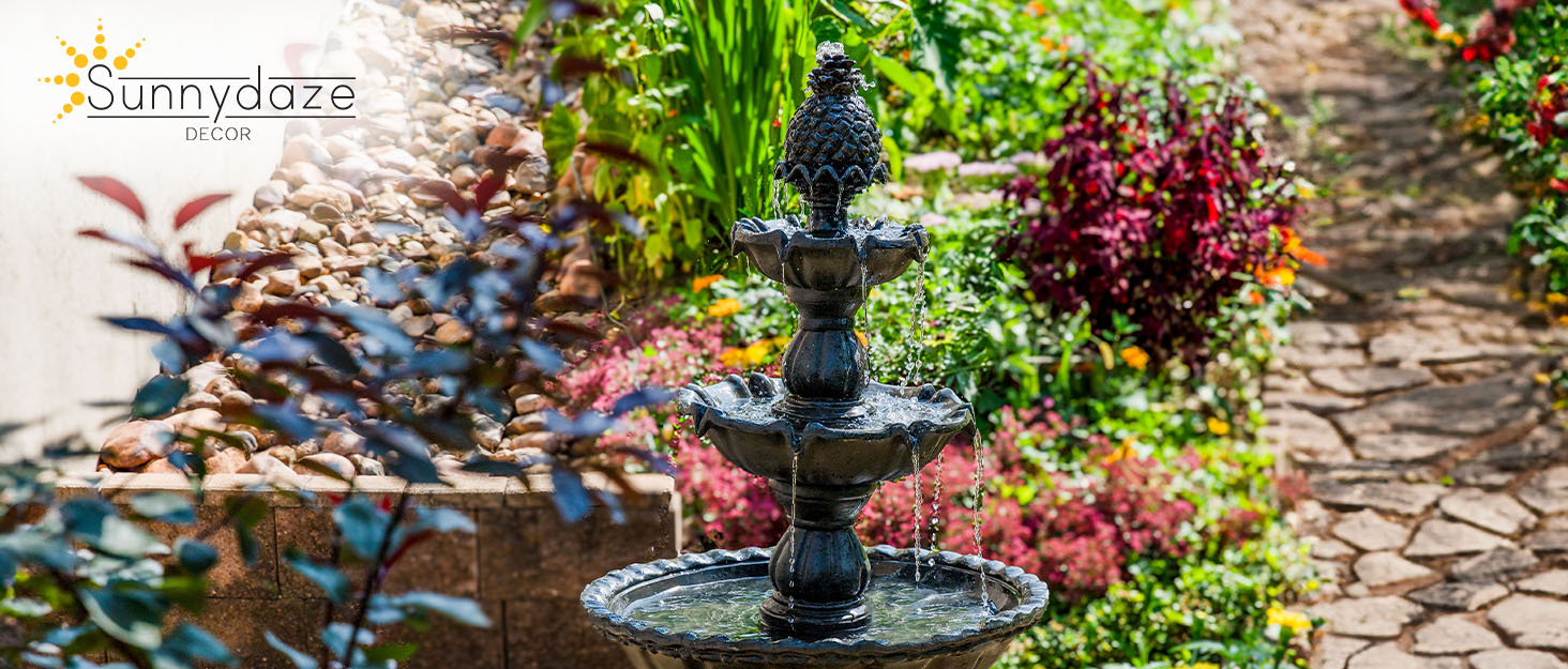 Fountain outdoors surrounded by beautiful landscaping and flowers