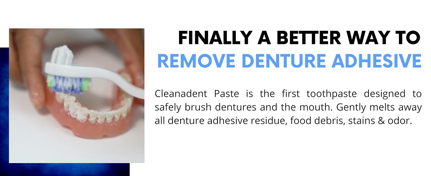 Hand holding denture and brushing it with toothbrush