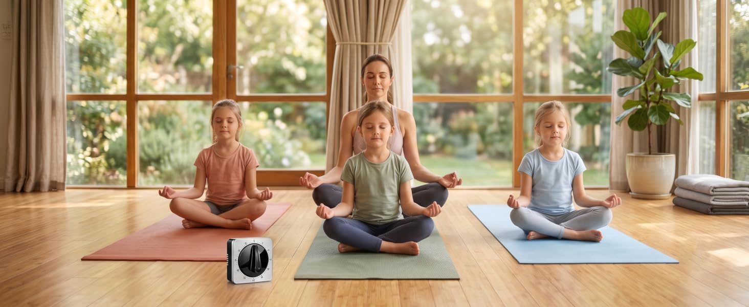 kitchen timer on the floor near a family practicing yoga.