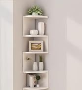 White corner floating shelves mounted on light gray wall, styled with minimalist decor items including plants and small accessories.