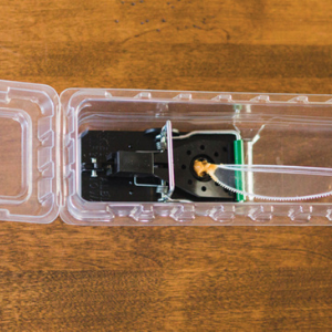 Bait cup on the snap trap enclosed. Use a dot of peanut butter for bait. Bait trough.
