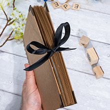 memory book with Black ribbon closure