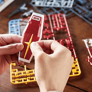 picture of hands building a model kit stating anone can easily assemble them
