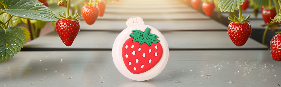 A vibrant strawberry field with lush green leaves and ripe, juicy red berries.