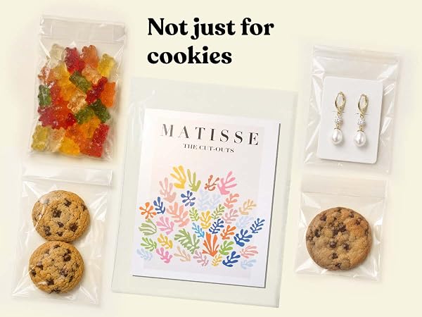 Clear Pack It Chic cello bags holding cookies, gummy candy, an art print, and pearl earrings