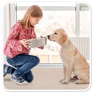 girl playing with the dog on our countertop protector mat
