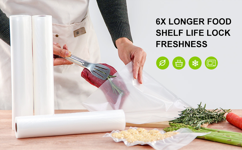 Vacuum-sealer bag rolls on the kitchen counter next to bags being filled with chunks of meat