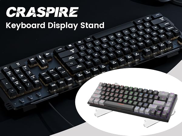 Craspire keyboard display stand shown in two variants - a full-size black mechanical keyboard and a compact gray keyboard with transparent acrylic supports.