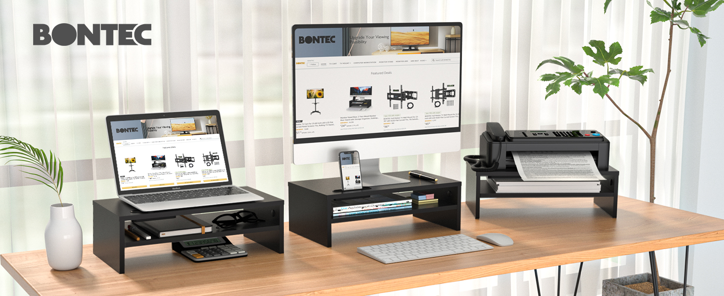 a desk with a laptop, keyboard, mouse, and a monitor.
