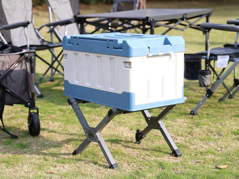 Ablazer folding cooler stand holding a cooler above the grass.