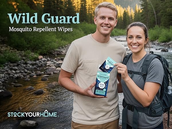 Two hikers by a river holding Stock Your Home Wild Guard Mosquito Repellent Wipes outdoors.