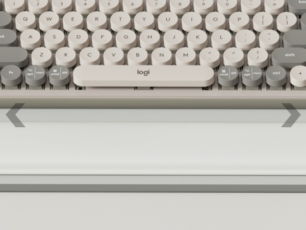 pop keys mist sitting on logitech desk mat extended mid gray mouse pad