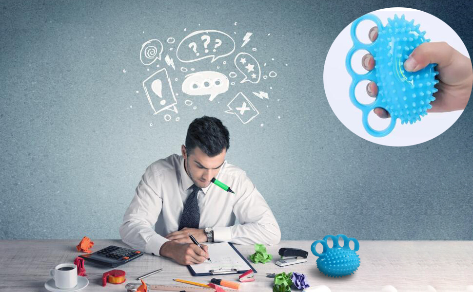 a man sitting at a desk with a clipboard and a pen in front of him.