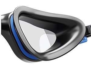 Close-up of a black swimming goggle with a blue seal around the lens. The lens is clear and reflective.