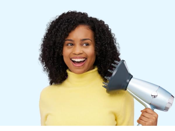 Woman using diffuser attachment