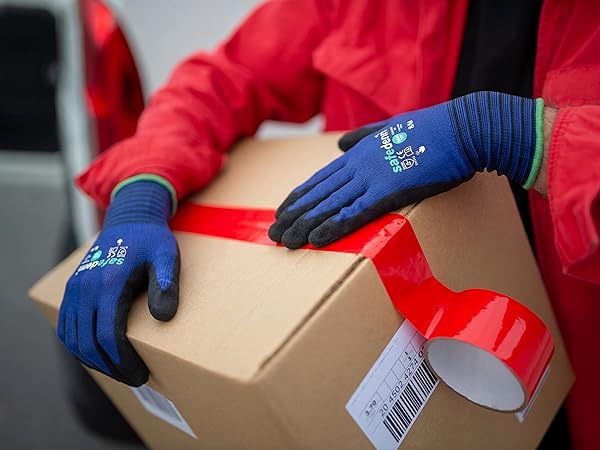 Safedenn 21-gauge nylon breathable work gloves worn by a warehouse worker holding a shipping box.