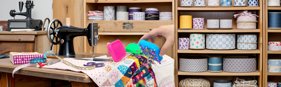 A colorful array of sewing supplies neatly arranged on a wooden table, with the product prominently