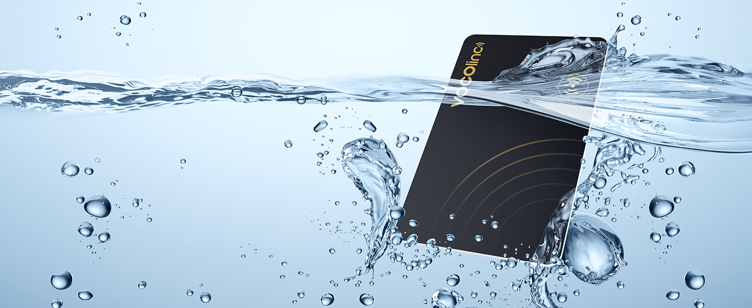 Black rectangular device submerged in water with splashes and bubbles, demonstrating water resistance. The device appears to be electronic, possibly a smartphone or similar gadget.