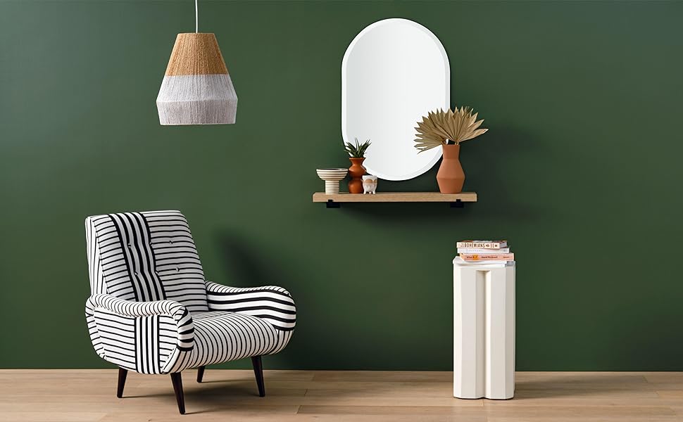 Green living room scene with oblong oval mirror