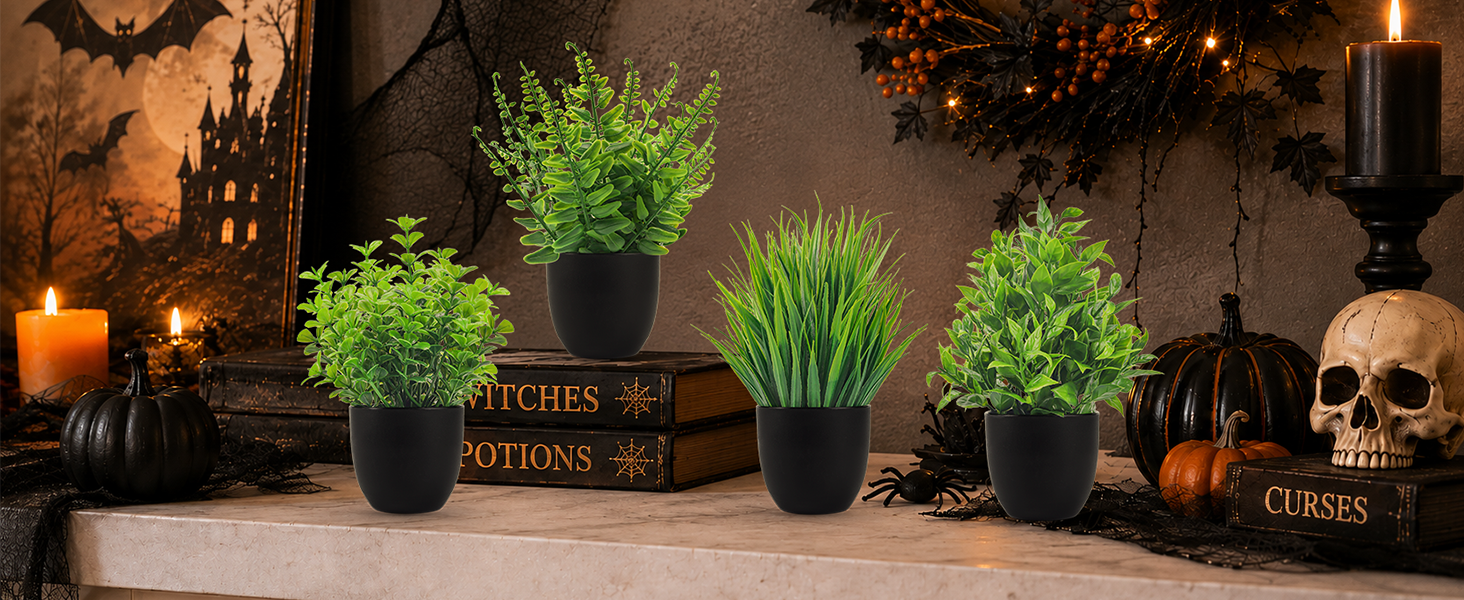 four artificial green plants black pots halloween decor