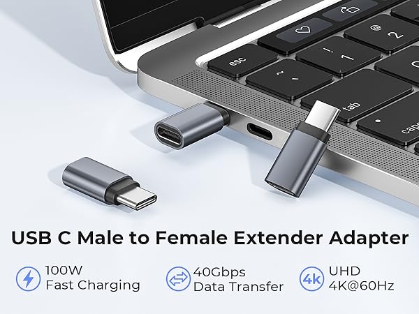 Text reads 'USB C Male to Female Extender Adapter', '100W Fast Charging', '40Gbps Data Transfer', 'UHD 4K@60Hz'. Multiple views of black USB-C adapter connector against white laptop keyboard background.